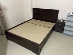 Queen size bed with one side table