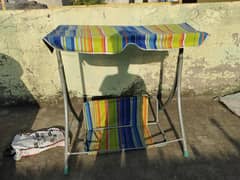 Jhoola ,baby cot ,used in good condition with free walker