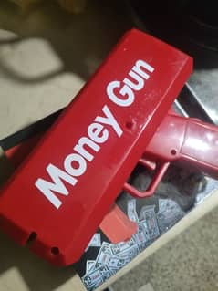 money gun with fake dollar