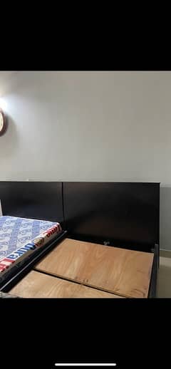 2 single beds with side tables and mattress