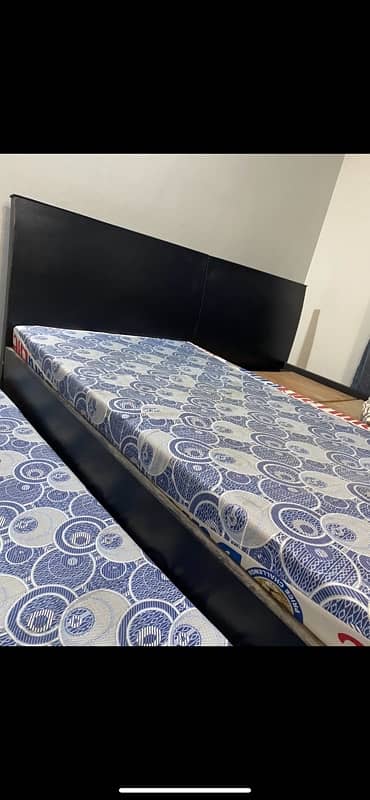 2 single beds with side tables and mattress 2