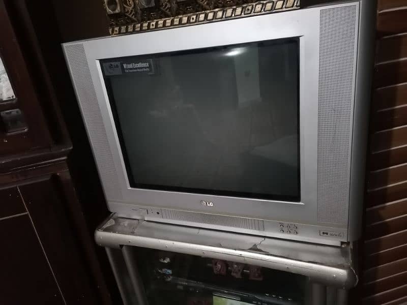 LG tv good condition  TV WITH TROLY 1