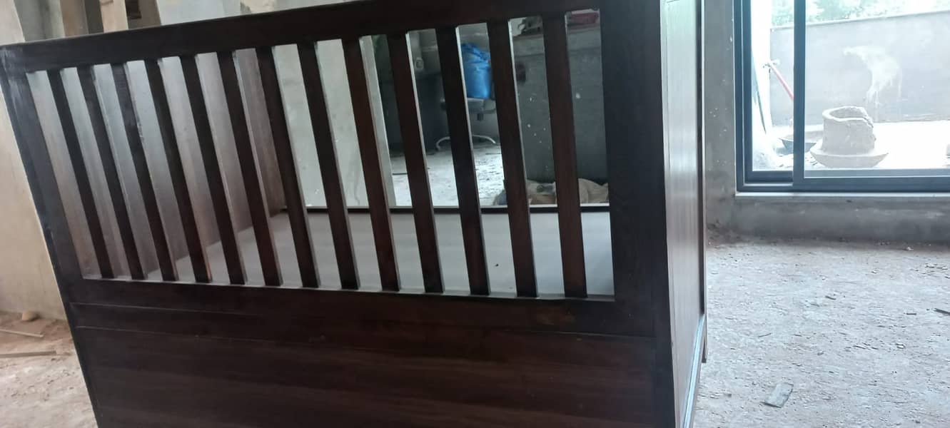 Baby cort in wooden structure with brown polish 2