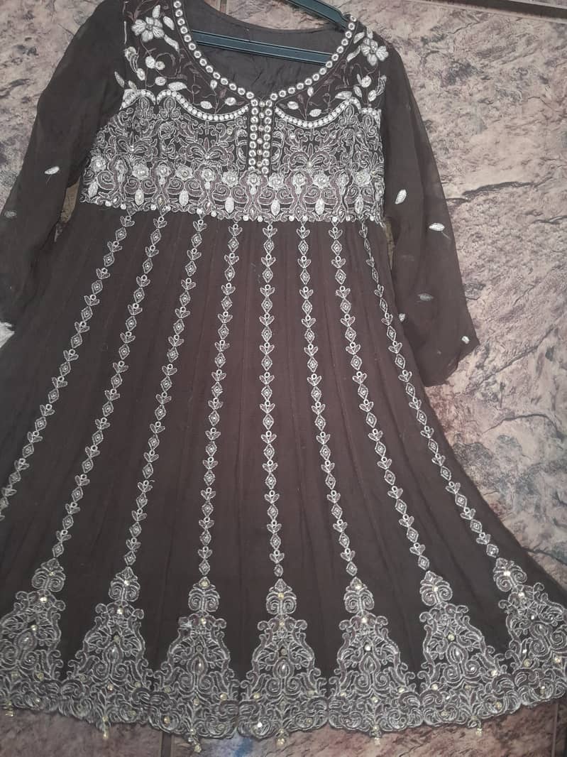 There is a very beautiful  frock with a lehenga 0