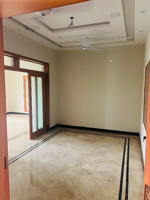 brand new lower portion for rent with real pics 3 bed rooms with attached bath and drawing daing tv loan kechin and 2 car parking available with Uper rentil famly 2