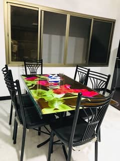 6 seater unbreakable dining table with black chairs