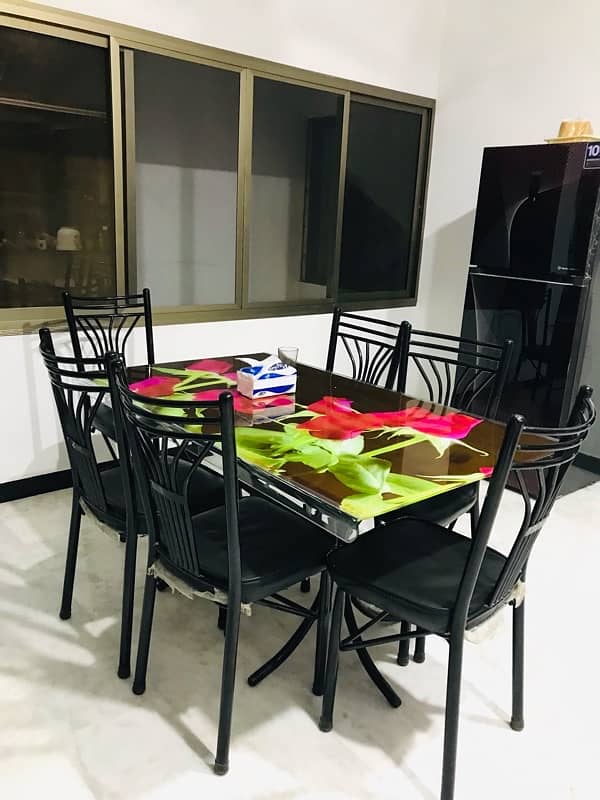 6 seater unbreakable dining table with black chairs 2