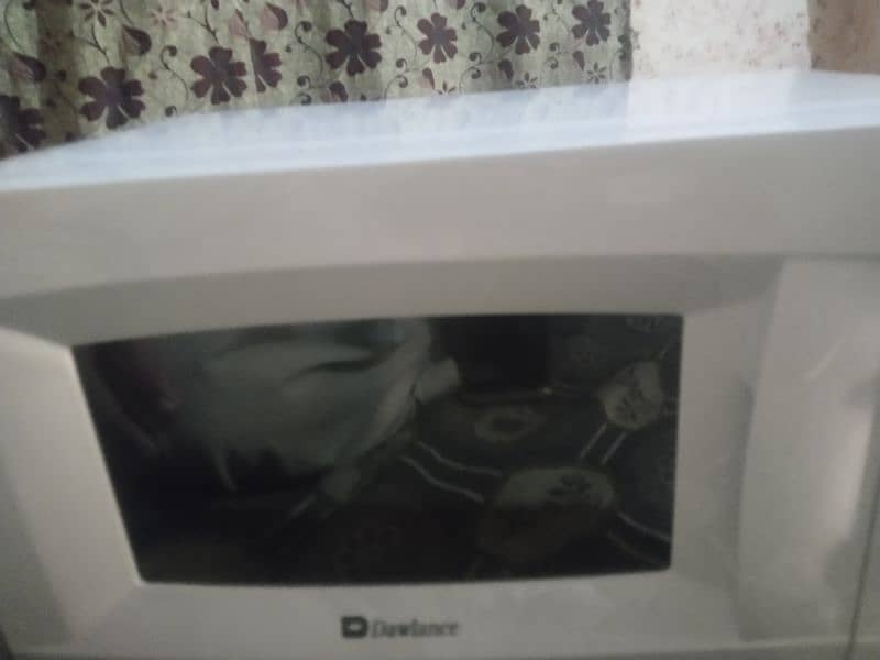 Brand New (untouched) -n: The Dawlance Microwave Oven MD 15 is 8