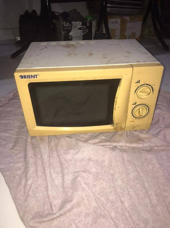 ORIENT MICROWAVE OVEN. 0