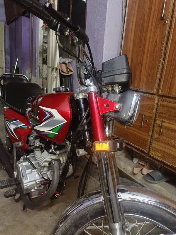 HONDA 125 2023 MODEL GOOD CONDITION ISLAMABAD NUMBER 9