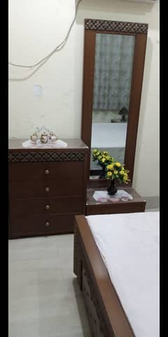 bed, side tables and dressing table