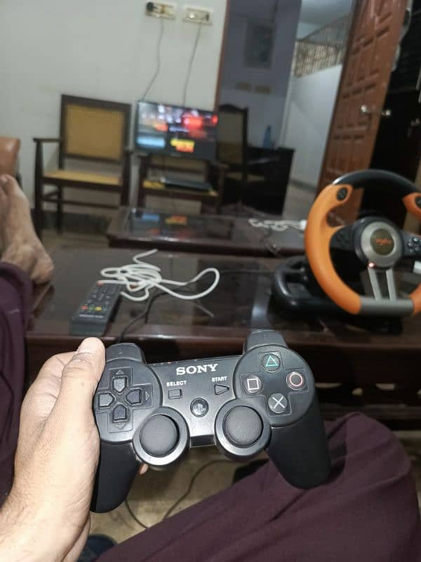 ps3 with steering wheel and pedals contact one WhatsApp and calls only 1