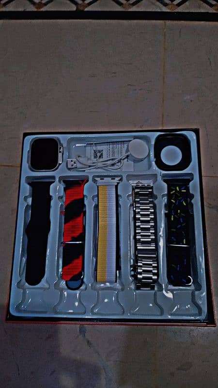 ultra watch with 10 straps and a case 1