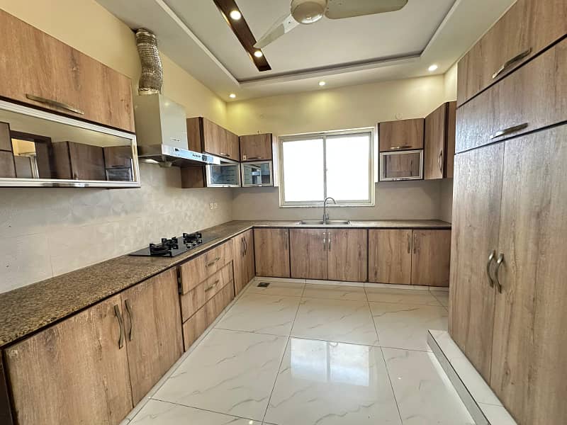 One kanal slightly used semi furnished bungalow available for rent in HBFChousingsociety 24