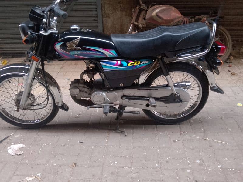 Honda CD 70 2024 4