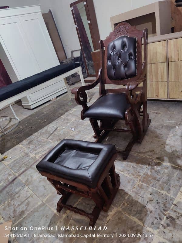 solid wooden rocking chair with foot rest available 10/9 condition 1