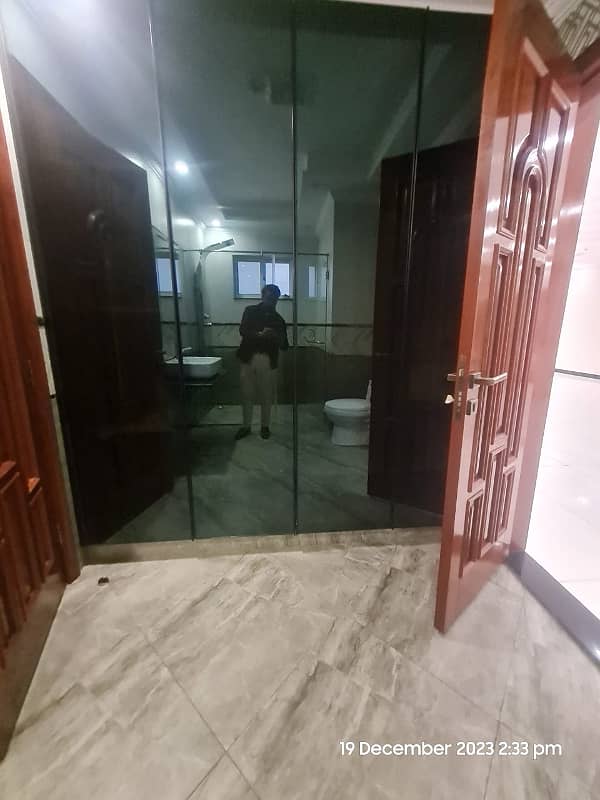 1 Kanal Brand New Super Hot Located Bungalow On Main Road With Full Basement And Home Theatre Is Available For Rent In The Best Block Of DHA Phase 6 Lahore Opposite To Lahore Garrison University 25