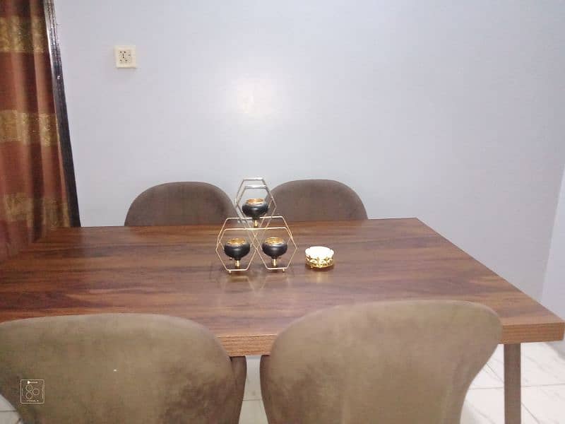 dining table with 4 brown chair and 3cotton 5