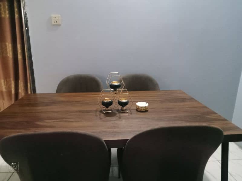 dining table with 4 brown chair and 3cotton 7