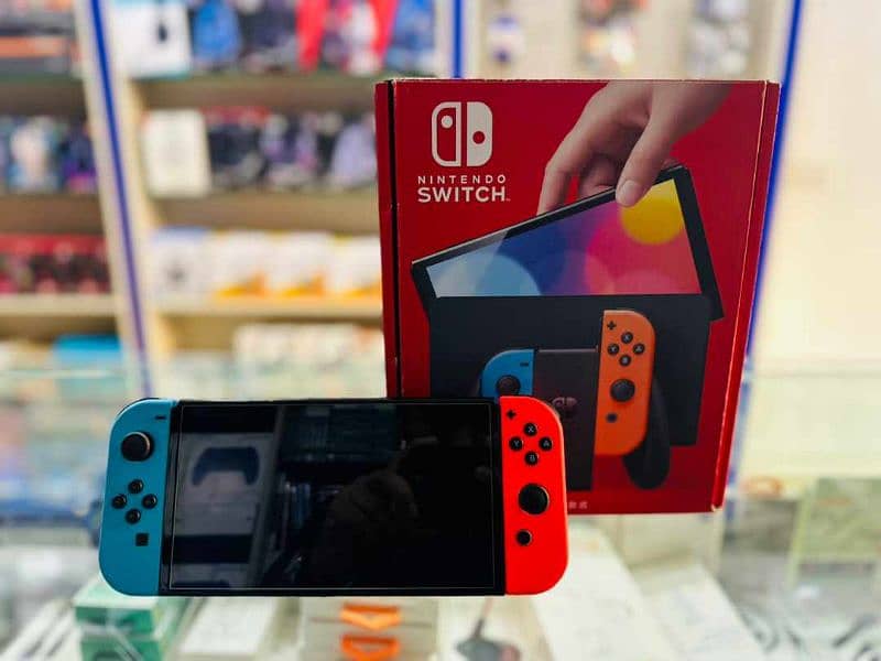 Nintendo switch oled Red and blue joycons complete box 0