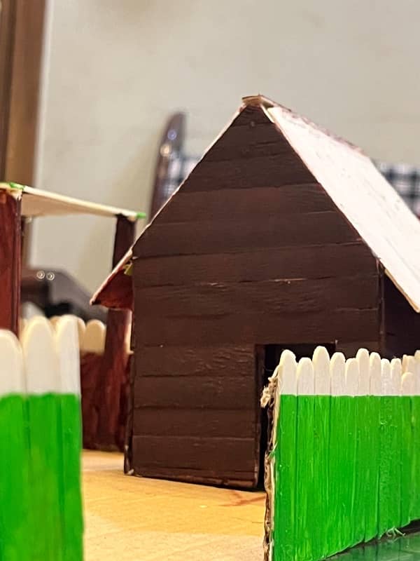 small house made from cardboard and ice sticks 2