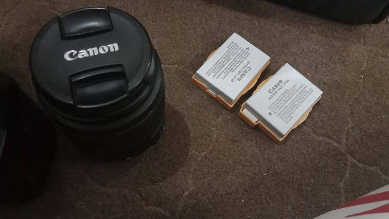 Canon 700D with 18-55mm lens, charger, 2 batteries, and bag 2