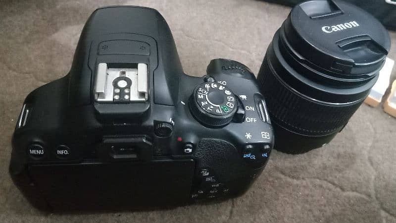 Canon 700D with 18-55mm lens, charger, 2 batteries, and bag 3