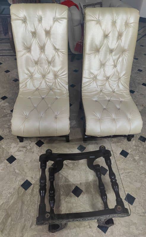 2 Hand Carved Room Chairs With A Glass Top Table. 1