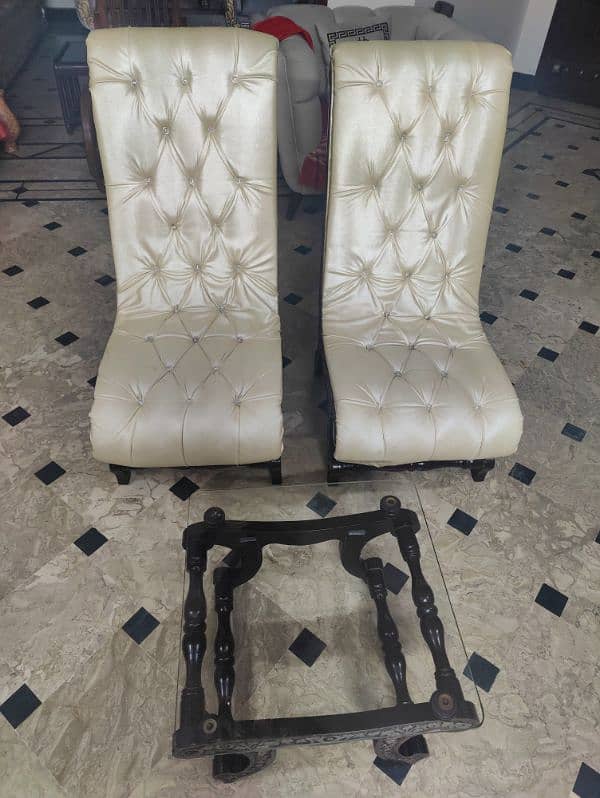 2 Hand Carved Room Chairs With A Glass Top Table. 3