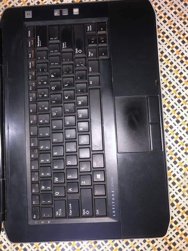 Dell laptop with smooth touchpad and fast charger, x64-based processor 1