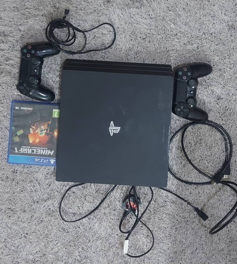 PS4 Pro 1 TB with original controller & mine craft CD 0