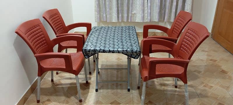 plastic chairs and table set 0