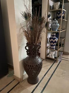 ceramic vase with pampas and peacock feathers