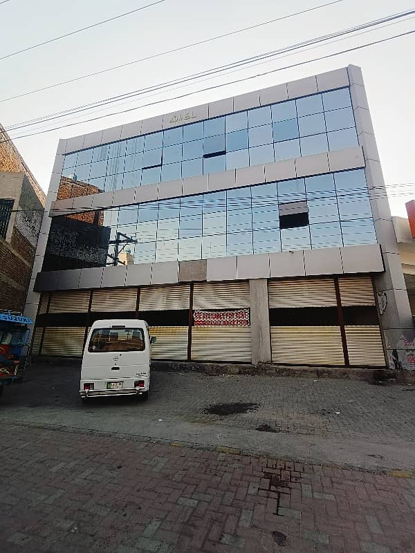 20 Marla Well Furnish 4 Storey Plaza Building For Rent at Main Canal Road near Kashmir pull Faisalabad 0