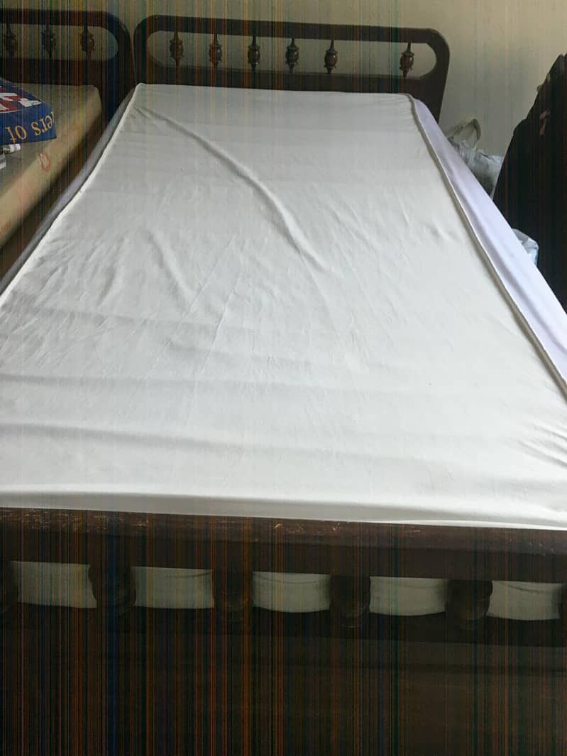 Two single beds with mattress with a free item 0