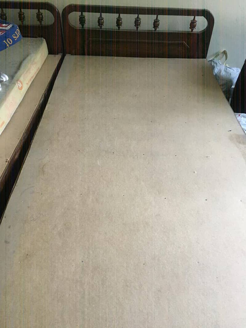 Two single beds with mattress with a free item 1