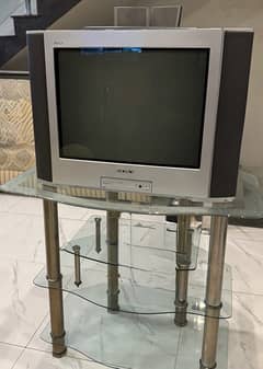 Sony TV with speakers and table