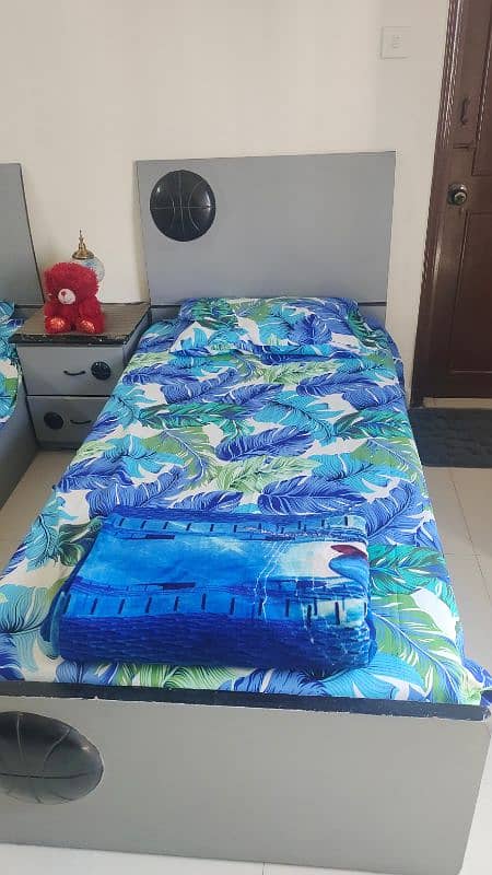 2 single bed with mattress included side table and wardrobe 3