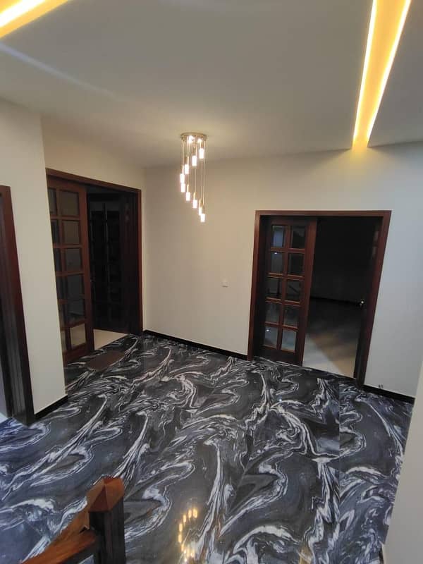 BEST FOR LIVING PURPOSES PRIME LOCATION UPPER PORTION AVAILABLE FOR RENT IN DHA ISB 11