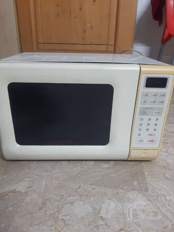 Singer microwave oven, almost in new condition only 1 year used 2