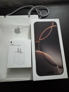 IPhone 16 Pro max desert with charger and receipt