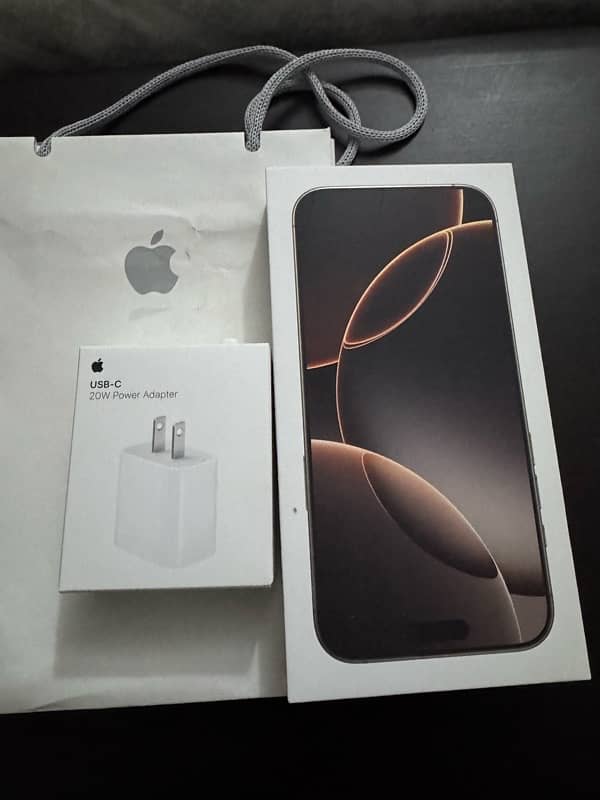 IPhone 16 Pro max desert with charger and receipt 0