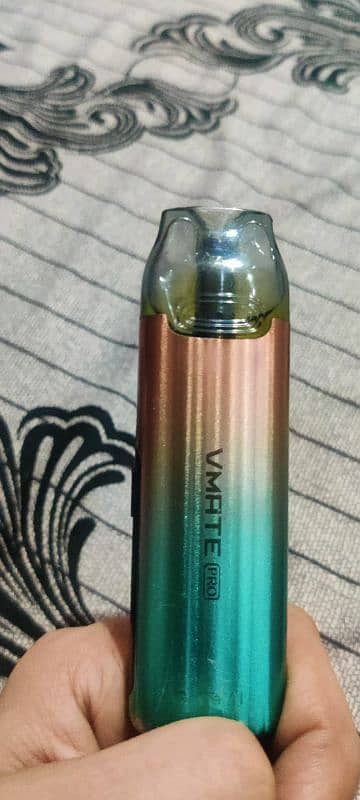 vmate pro pod with new coil and bottle of flavour 0