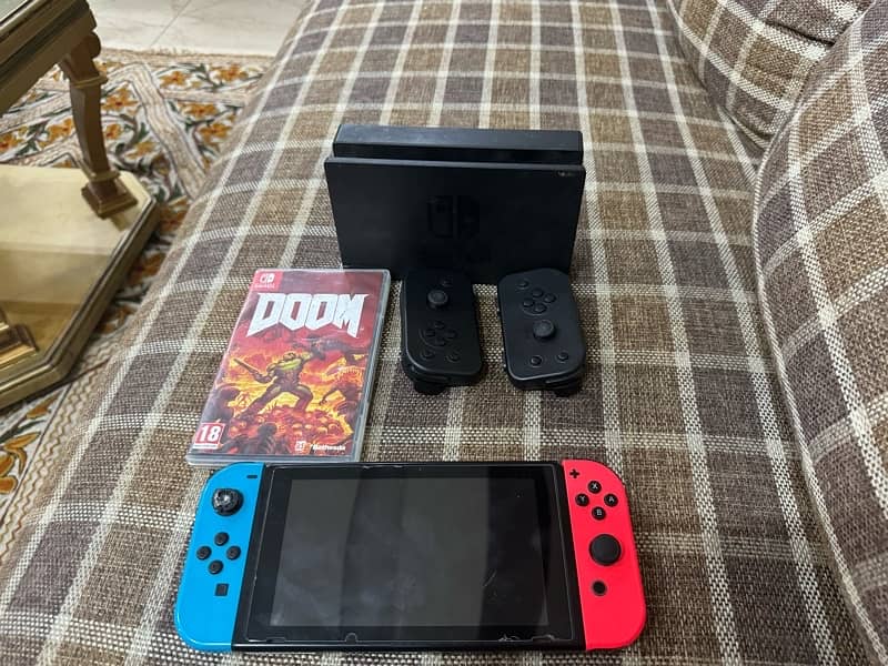 Nintendo switch with 2 extra controller + 1 game card (Doom) 0