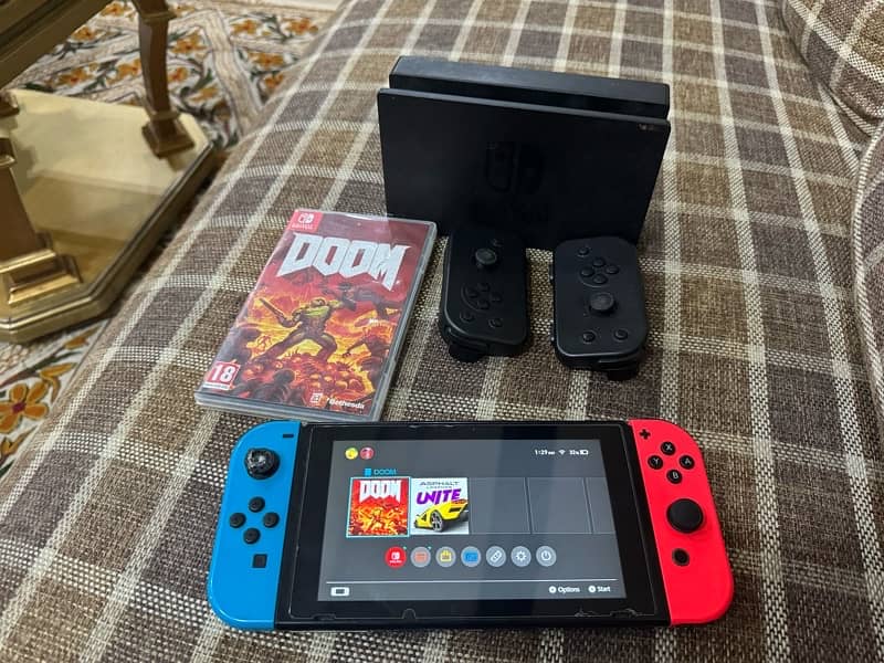 Nintendo switch with 2 extra controller + 1 game card (Doom) 3