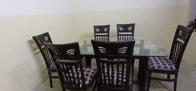 Dinning table with six wooden chairs