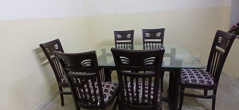 Dinning table with six wooden chairs 0