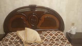 wooden bed in good condition