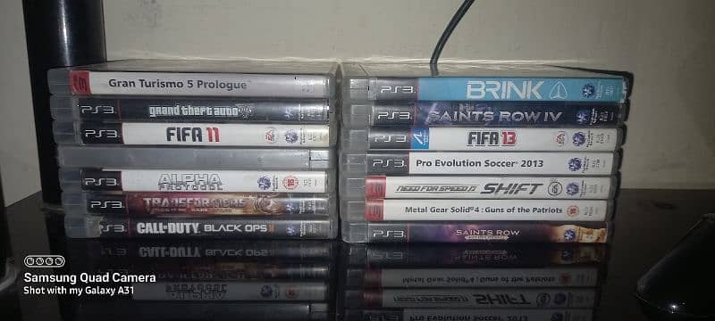 Play Station 3 with 1 controller and 14 game CDs 2