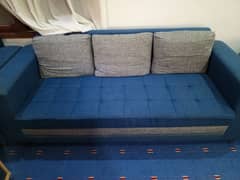 blue coloured sofa in good condition used